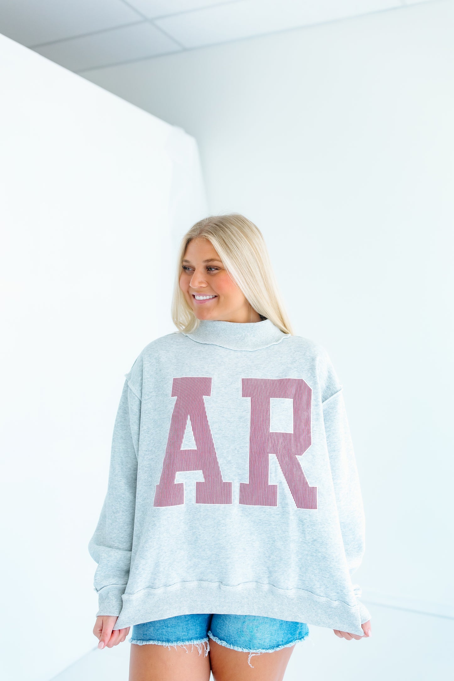 AR EMBROIDERED MOCK NECK SWEATSHIRT