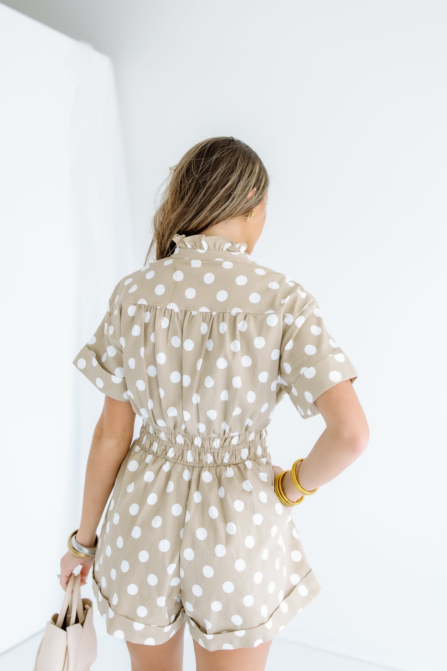 ON A JET POLKA DOT ROMPER