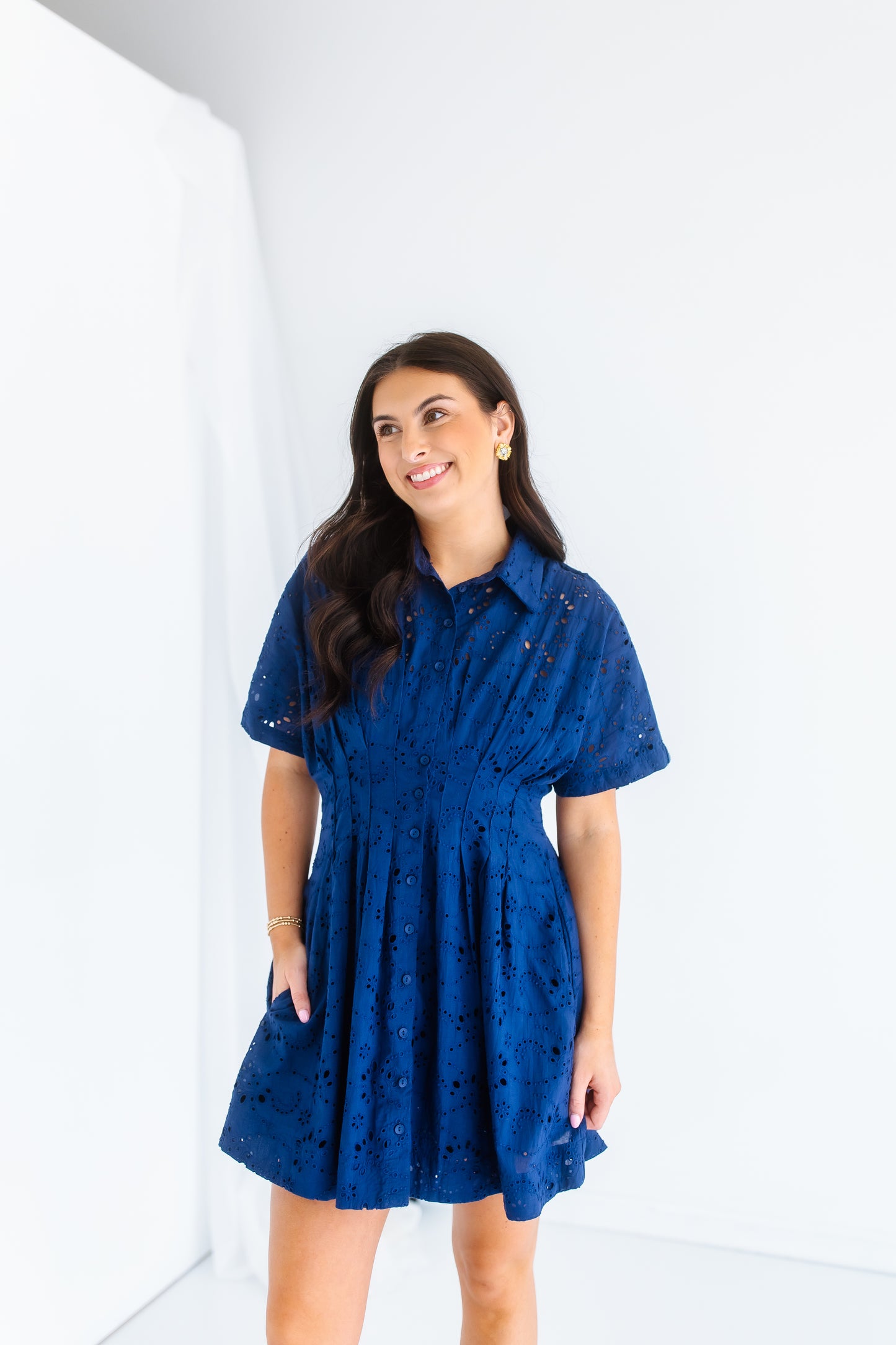 NAVY PLEATED EYELET DRESS