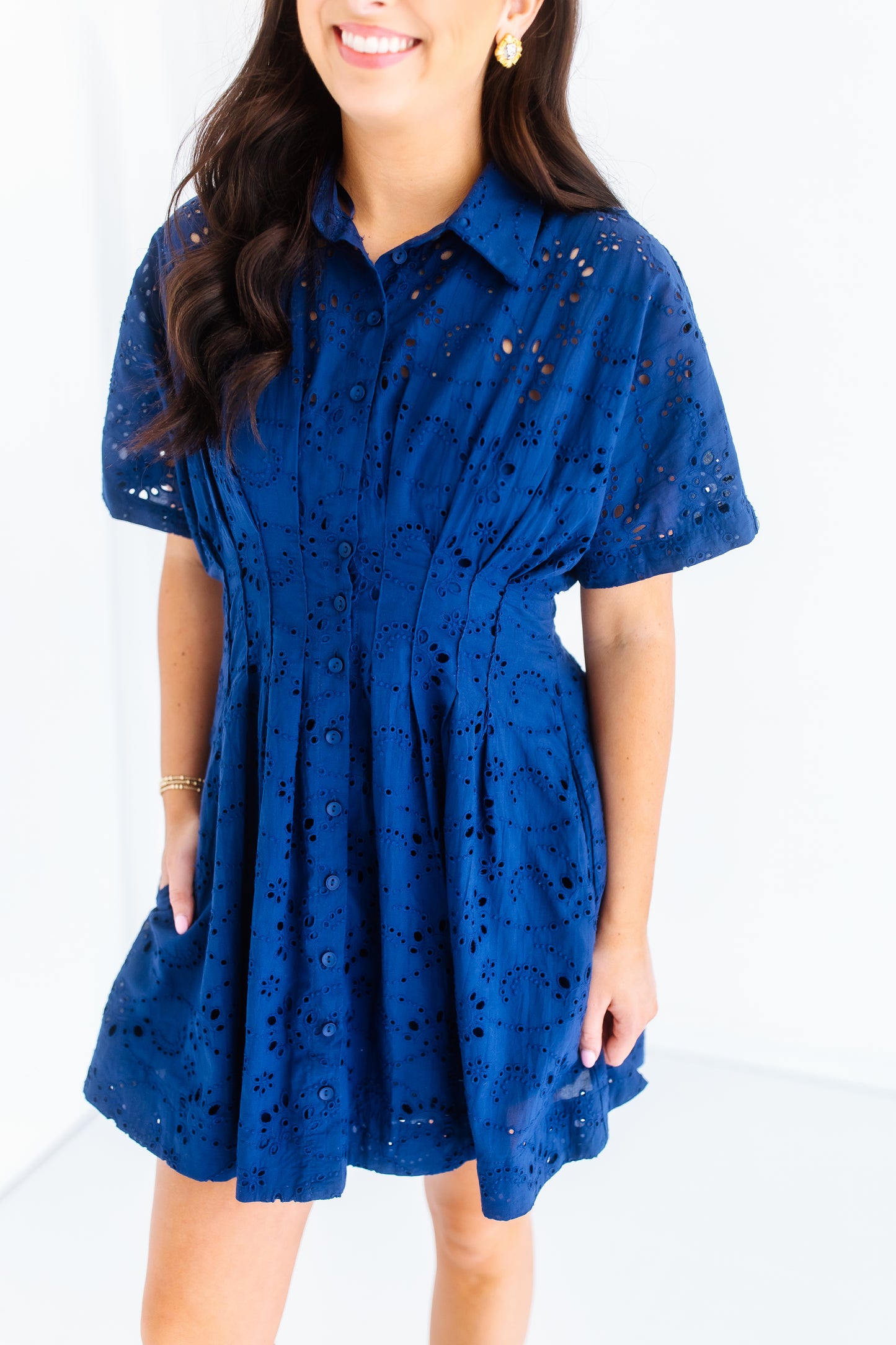 NAVY PLEATED EYELET DRESS