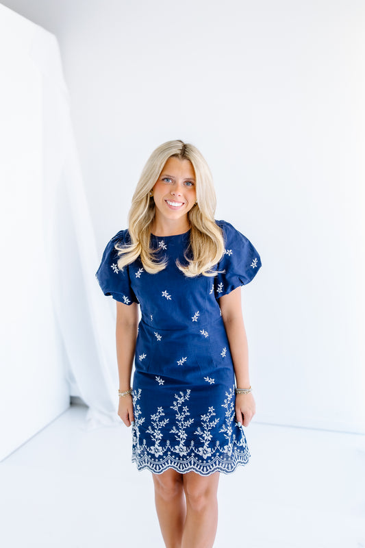 ON THE MOVE MINI DRESS