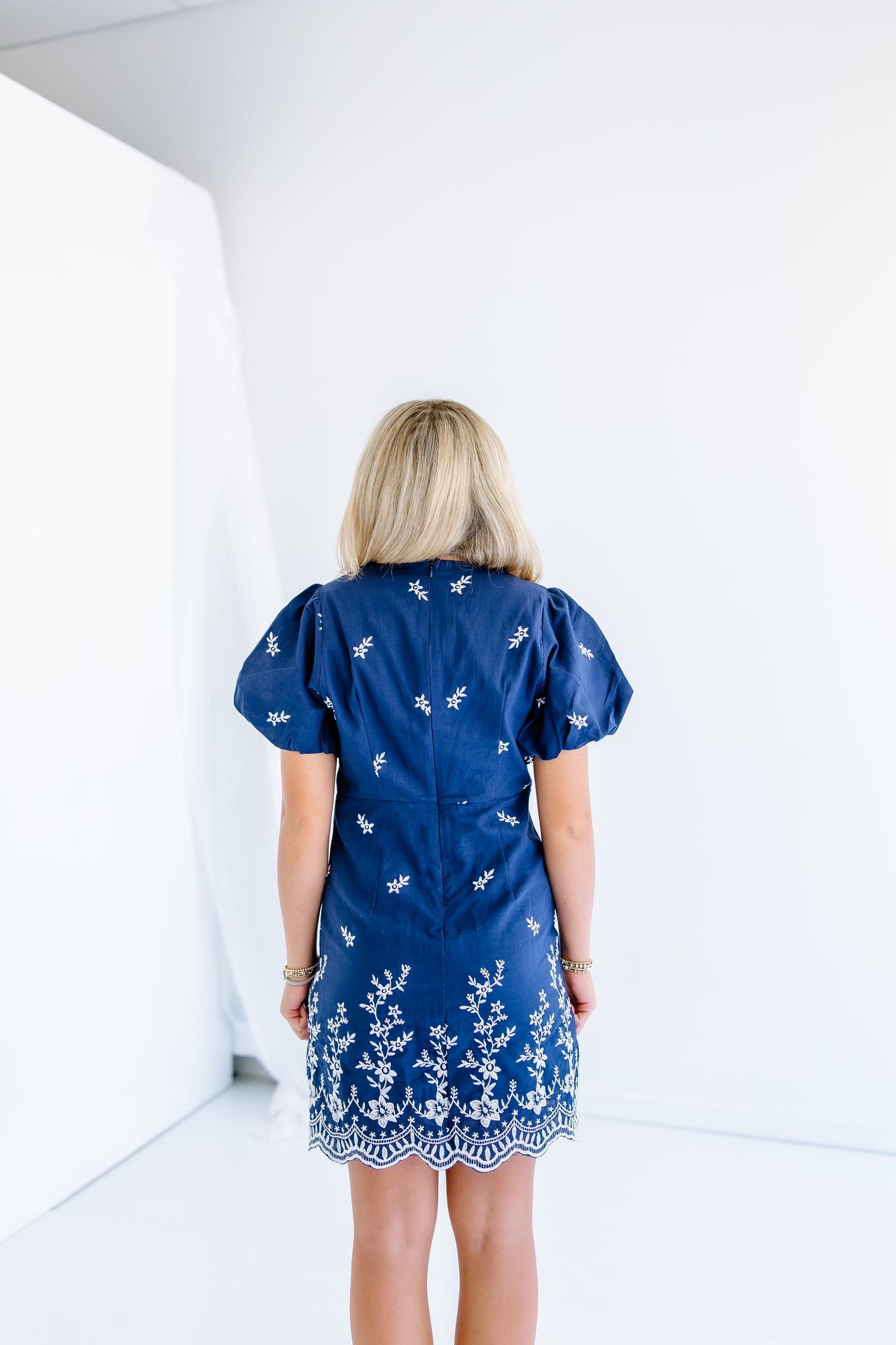 ON THE MOVE MINI DRESS
