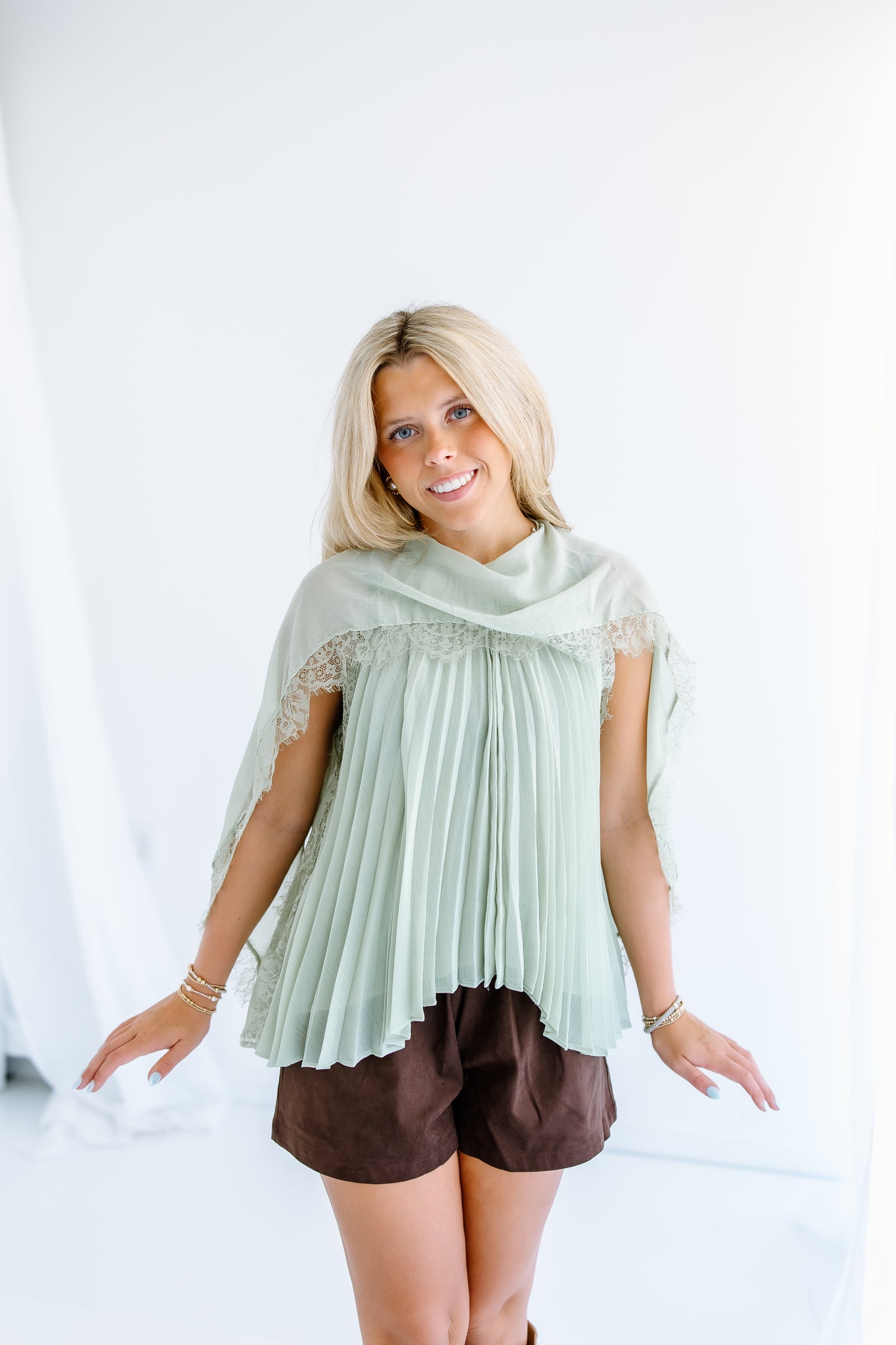 PLEATED FLOWY CAPE BLOUSE