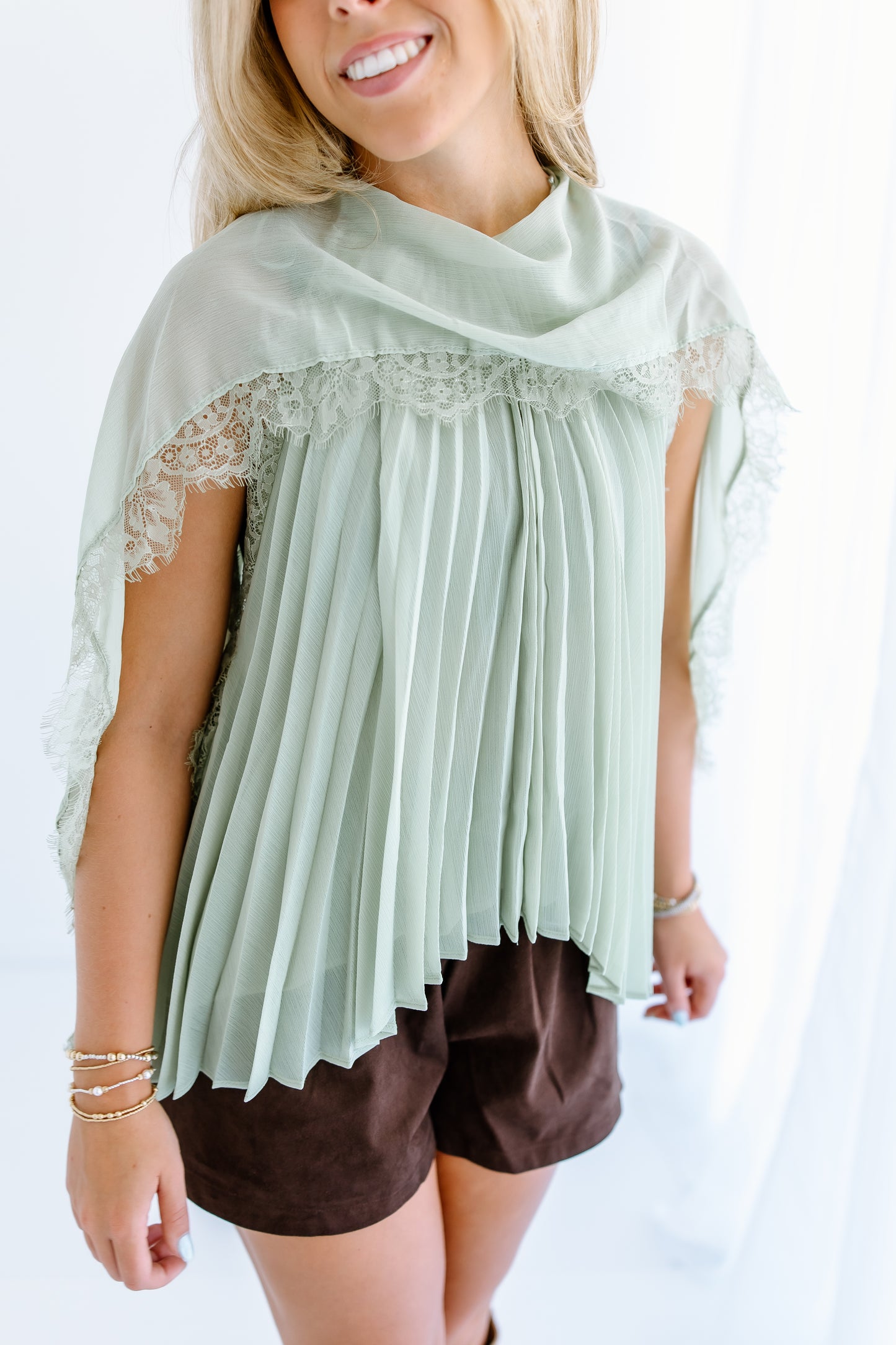 PLEATED FLOWY CAPE BLOUSE