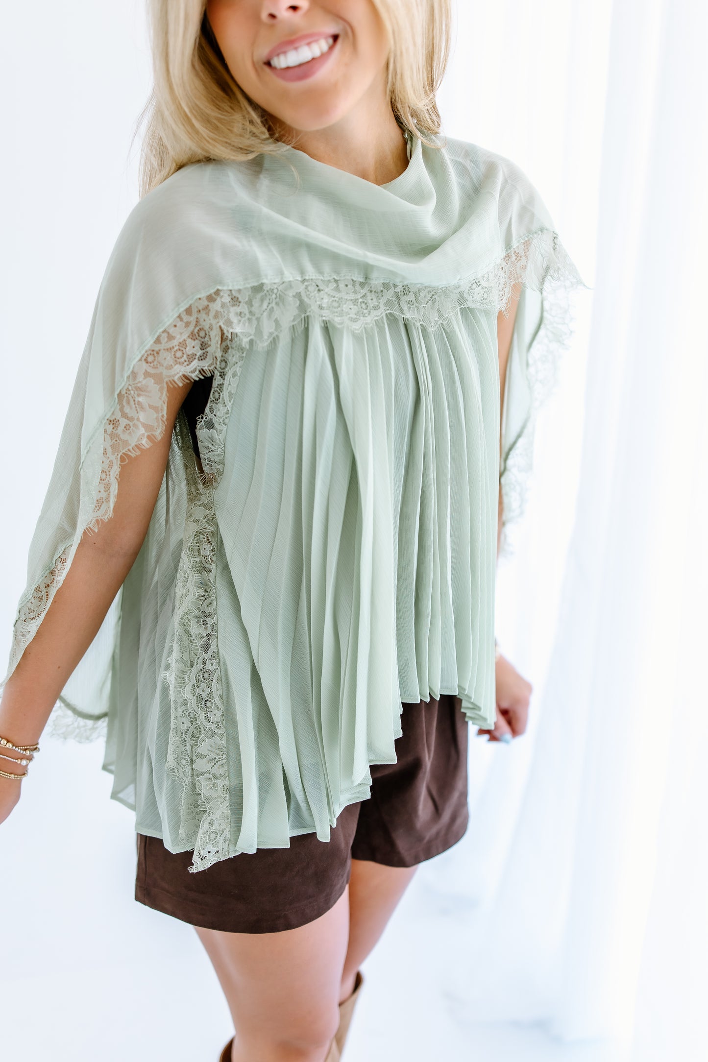 PLEATED FLOWY CAPE BLOUSE