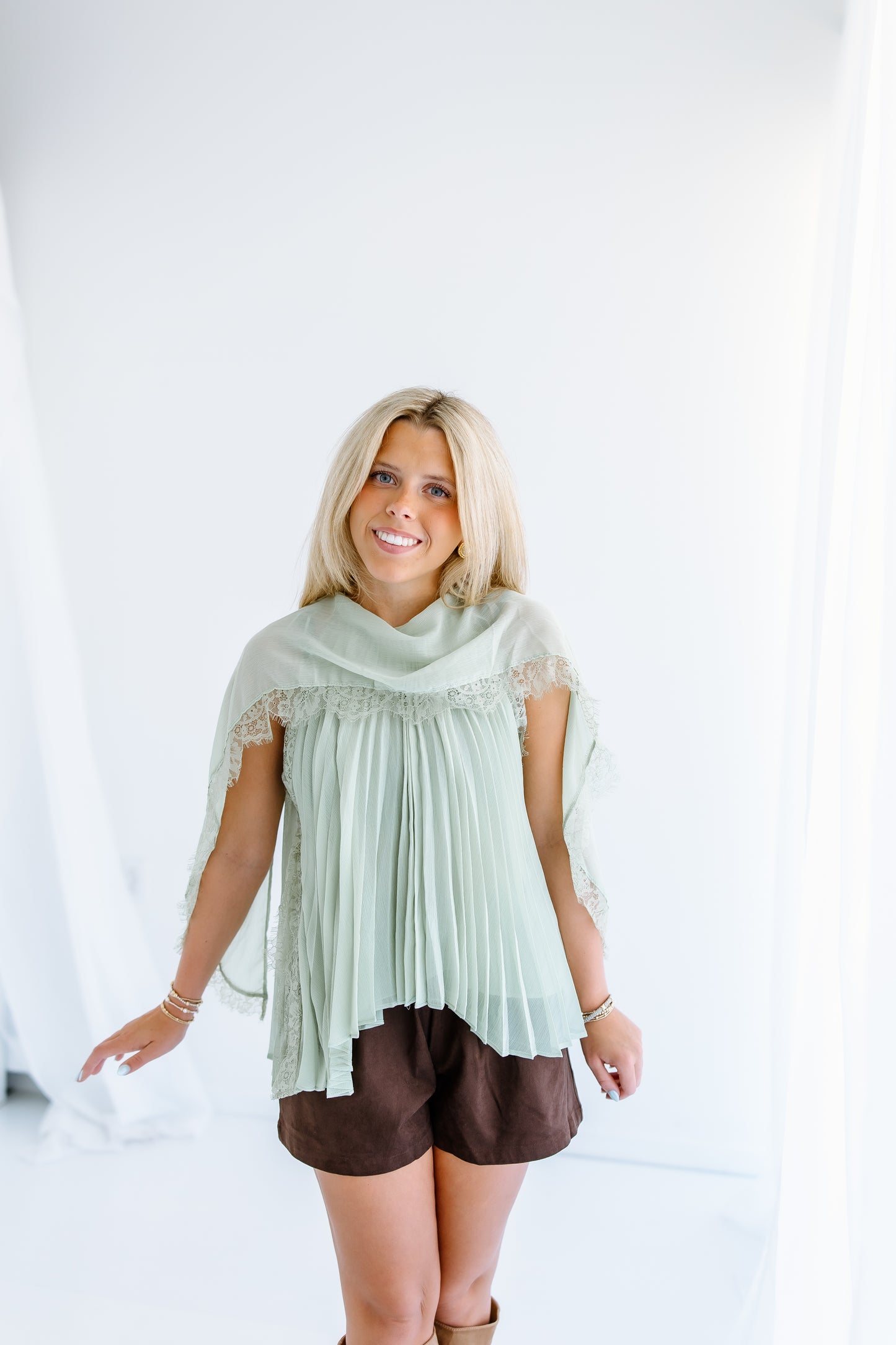 PLEATED FLOWY CAPE BLOUSE