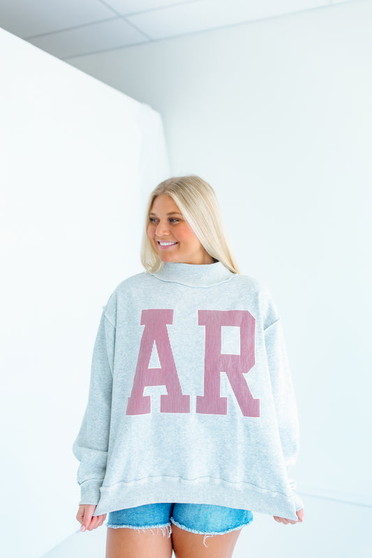 AR EMBROIDERED MOCK NECK SWEATSHIRT