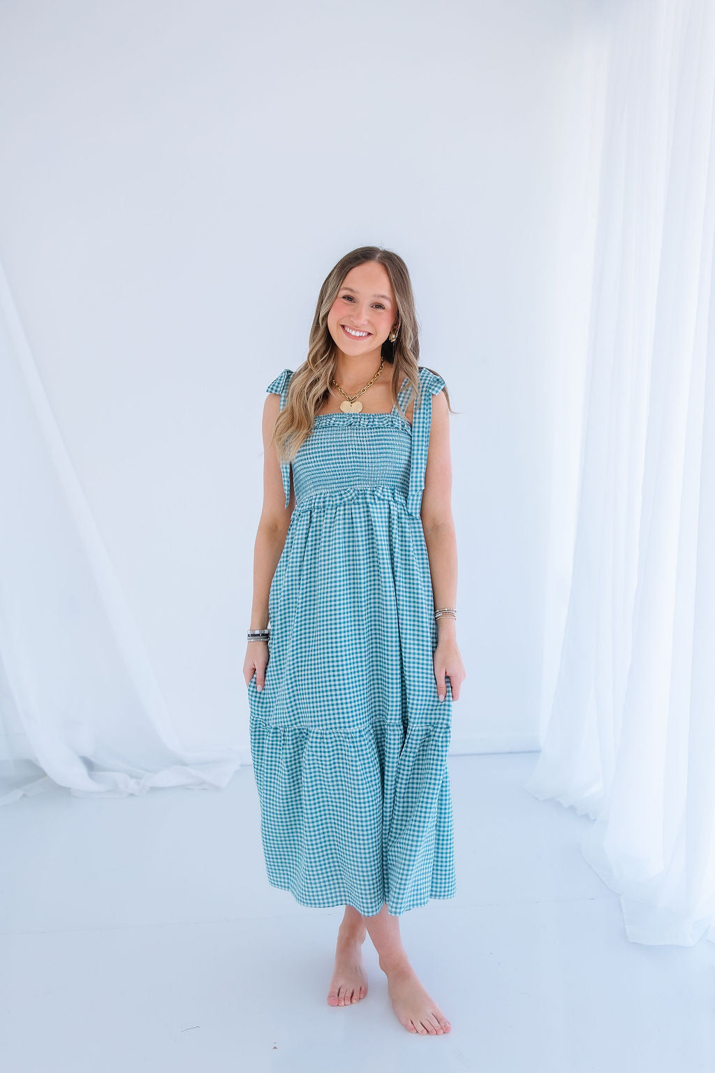 SMOCKED GINGHAM MIDI DRESS