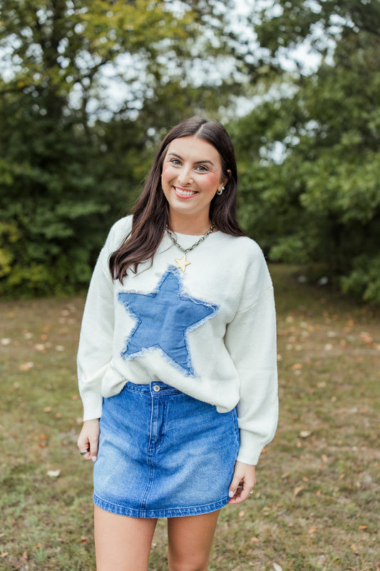 DISTRESSED DENIM STAR SWEATER